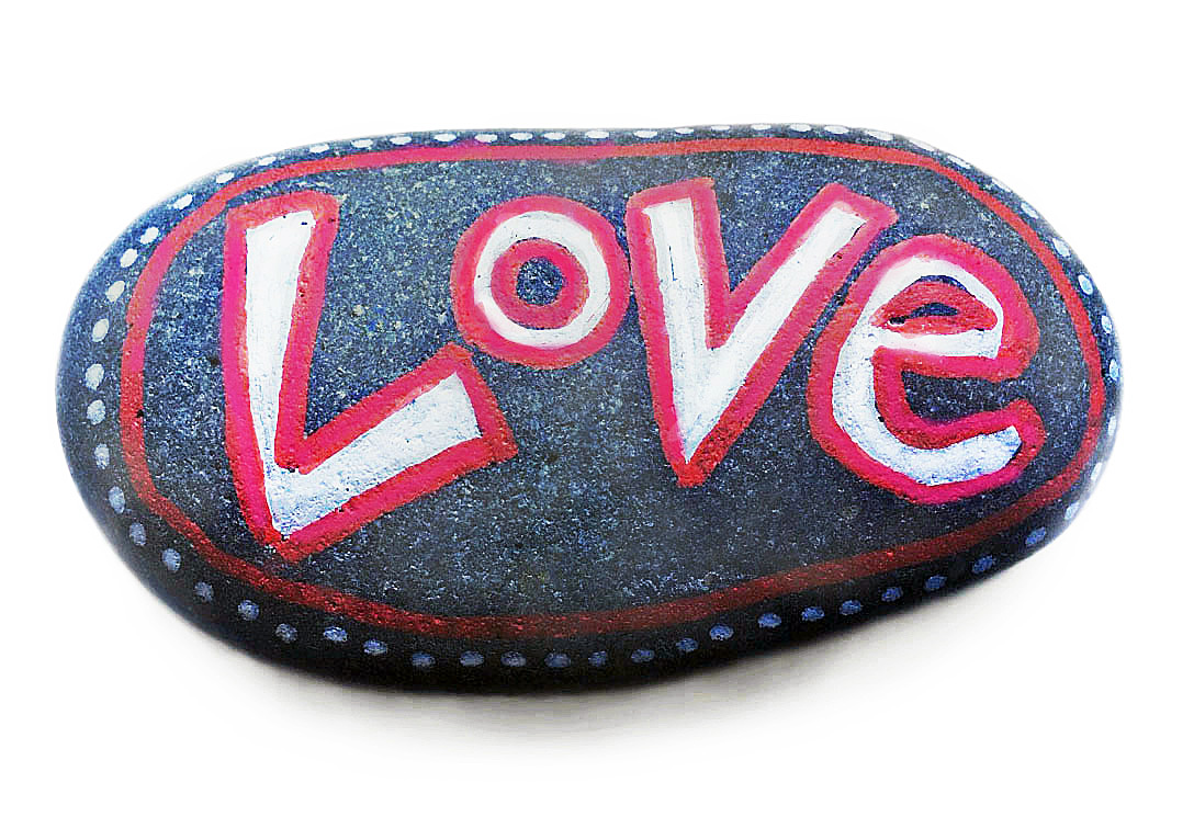 LOVE STONE with the word "Love" painted in white and outlined in red, available in the Gift Store.