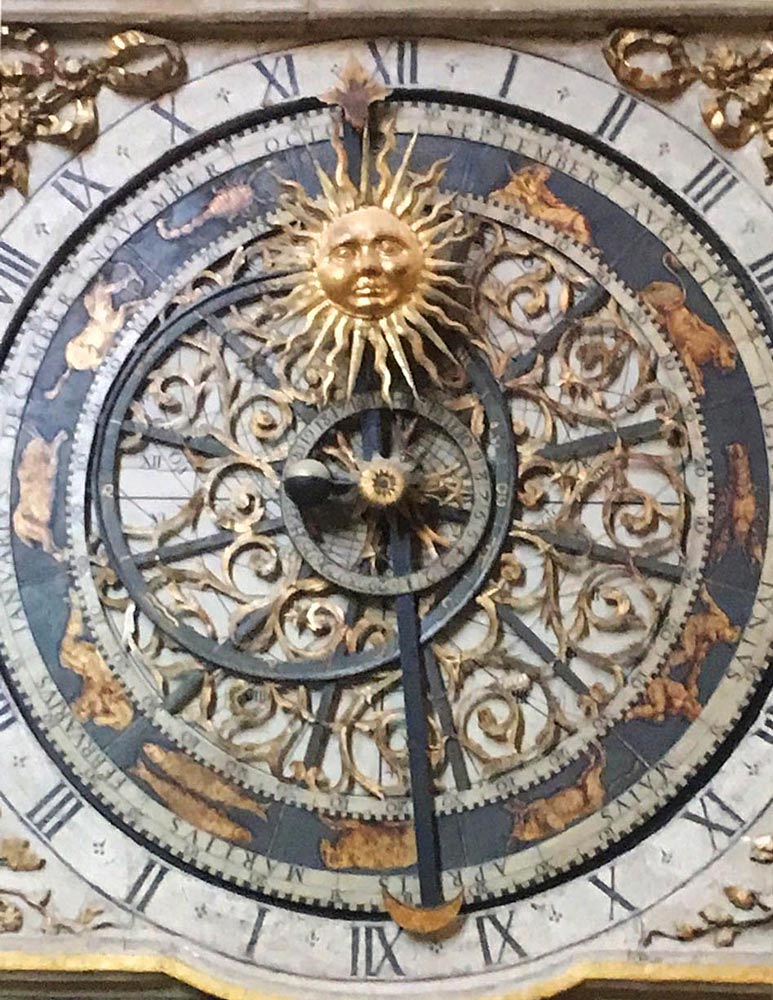 Clockface on an ornate 14th C clock inside Lyon Cathedral in Lyon, France.