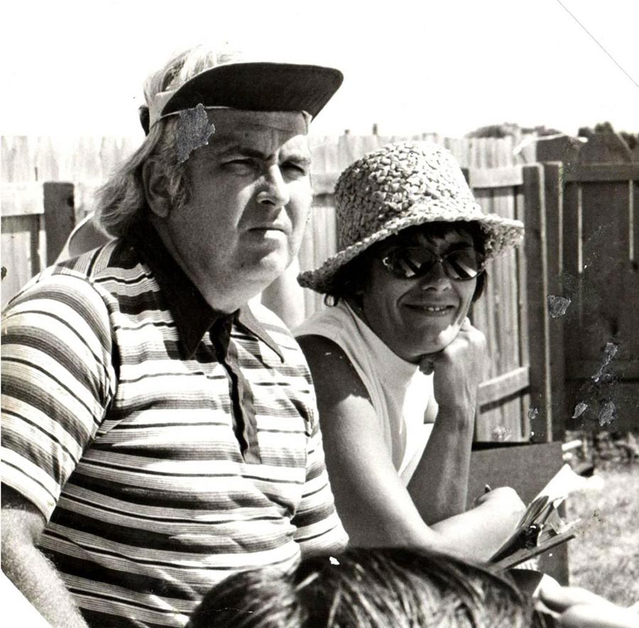 Black & white vintage photo of Ken and Fran Williams, parents of Ralph Williams, watching a swim meet.