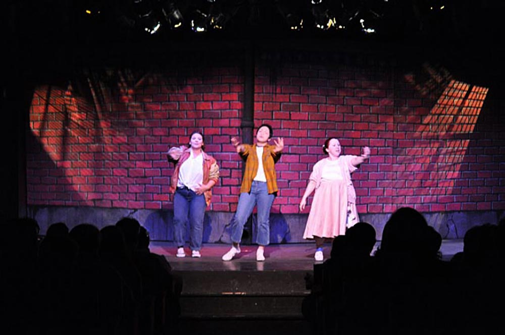 Three women perform the opening scene to "Little Shop of Horrors" at the Roadside Theater on Patton Army Base in Heidelberg, Germany in 2010.