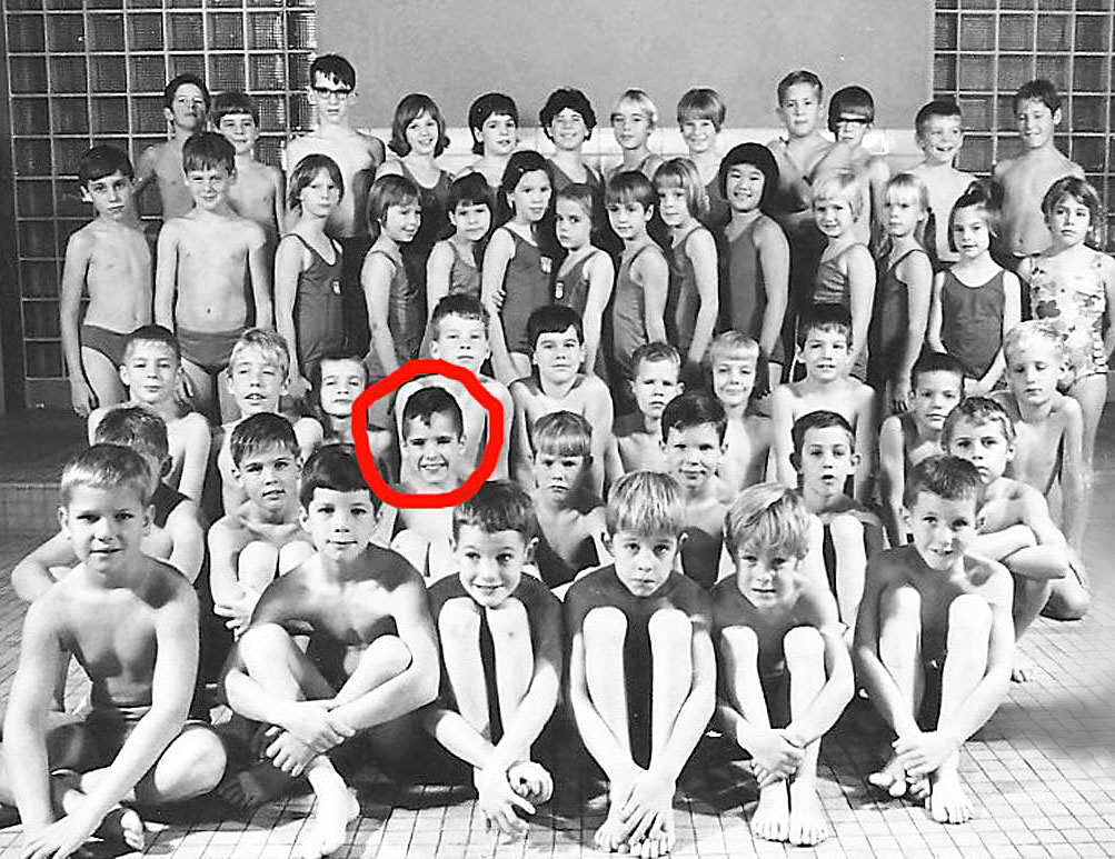 Vintage swim team photo of the Phillips 66 'Splash Club" in Bartlesville, OK with a red circle drawn around the face of Ralph Williams.