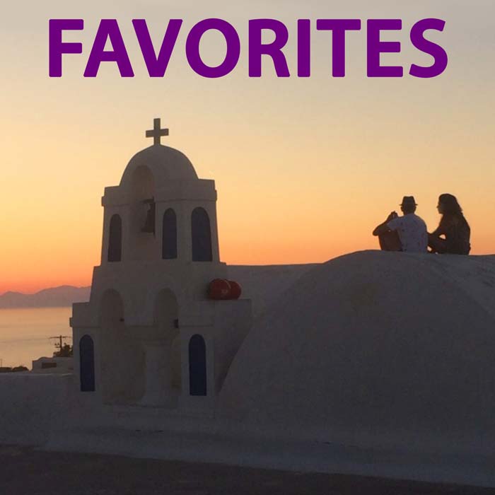 The cover image for the FAVORITES photo album features a couple in sihlouette, sitting side-by-side on the roof of a white stucco church at sunset in Santorini, Greece.