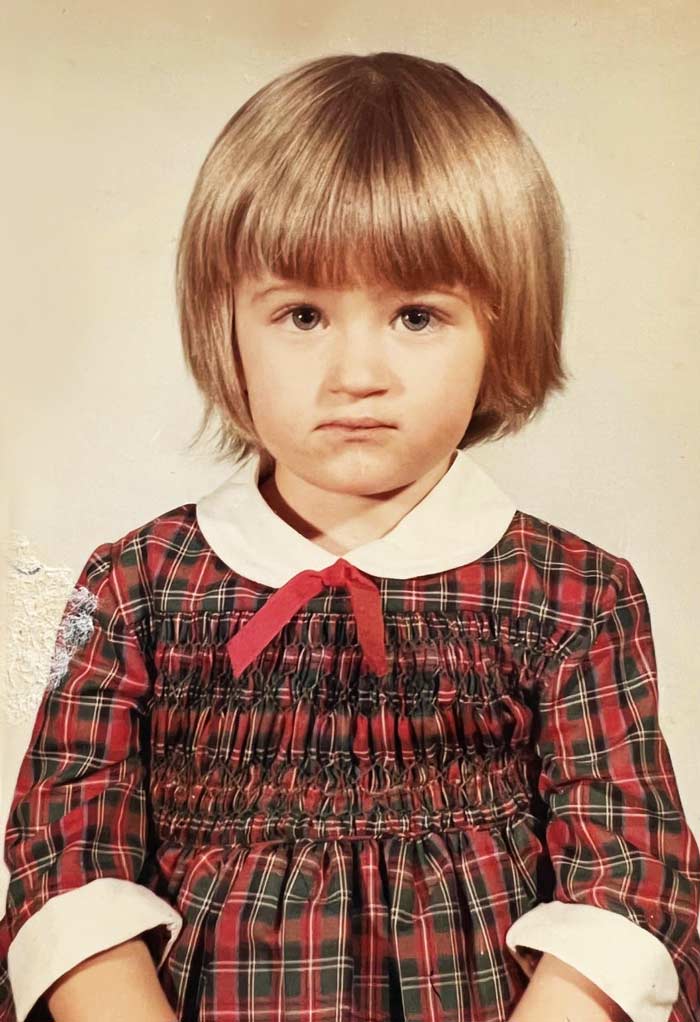 1st Grade school portrait of Dana Brock looking shy.