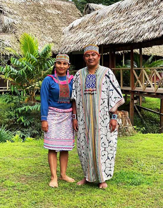 Standing portrait of Misa Miller's shaman-advisor with his wife in Peru.