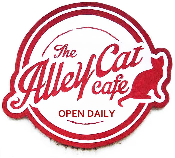 Circular logo for the ALLEY CAT CAFE, featuring a cat in sihlouette beside the name.