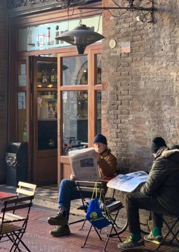 Enjoying a crisp morning outside a cafe in Bologne, Italy
