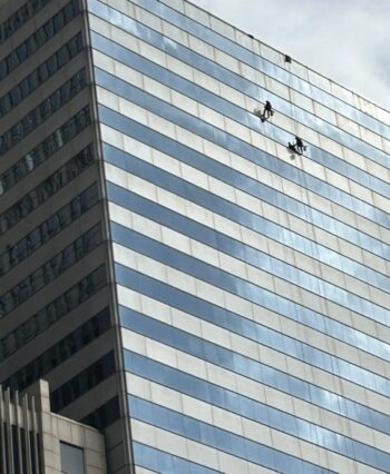 YIKES! Two window cleaners dangle off the side of the USG Building in Chicago. Is it just me or do they look like a pair of ants scaling a wall?