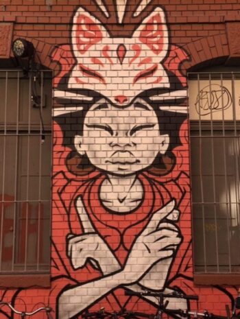 An intriguing mural on the side of the Rote Fabrik Art Center features an Asian woman with a cat on her head holding a can of spray paint. Nicely done.