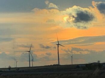 It's late-afternoon and the wind turbines are turning along I-40 in eastern Kansas.