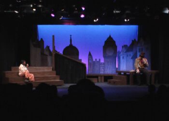 I barely remember working on this production, but I do recall liking the way my painting work on the cityscape came out. Looks even better close up!