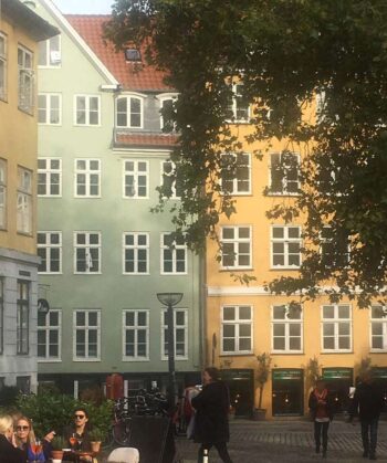The hazy look of this photo combined with the soft building hues and red tile roofs really captures the feeling of Copenhagen.