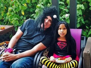 Here I am, wearing a ratty wig and sitting beside my niece, Kte (dressed as a "Super Bee"), at a Halloween party in San Diego. She's like, "I don't know him!"