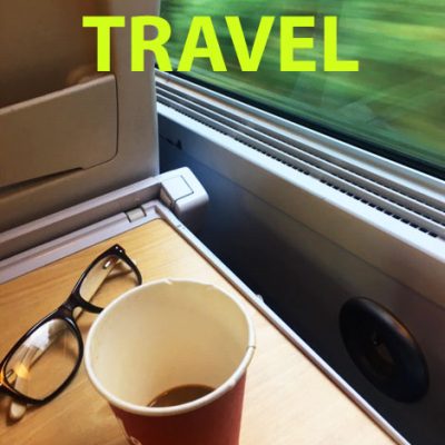 The cover image for the TRAVEL photo album was taken from a window seat on a moving train with the scenery whizzing by outside.